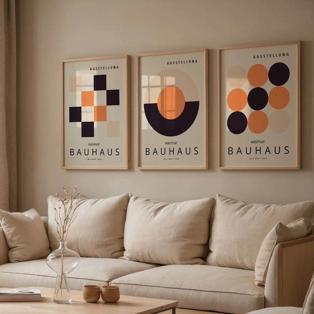 beige black and orange geometric bauhaus poster set in contemporary office workspace