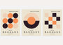 bauhaus poster set of 3 with beige black and orange circles half circles and modular layouts