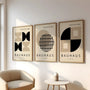 beige and black bauhaus poster set arranged in modern home gallery wall