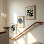 navy and black bauhaus poster set arranged in modern gallery wall
