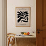 Black flowers poster styled in minimalist living room with modern decor