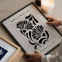 Black botanical graphic poster in minimalist bedroom interior