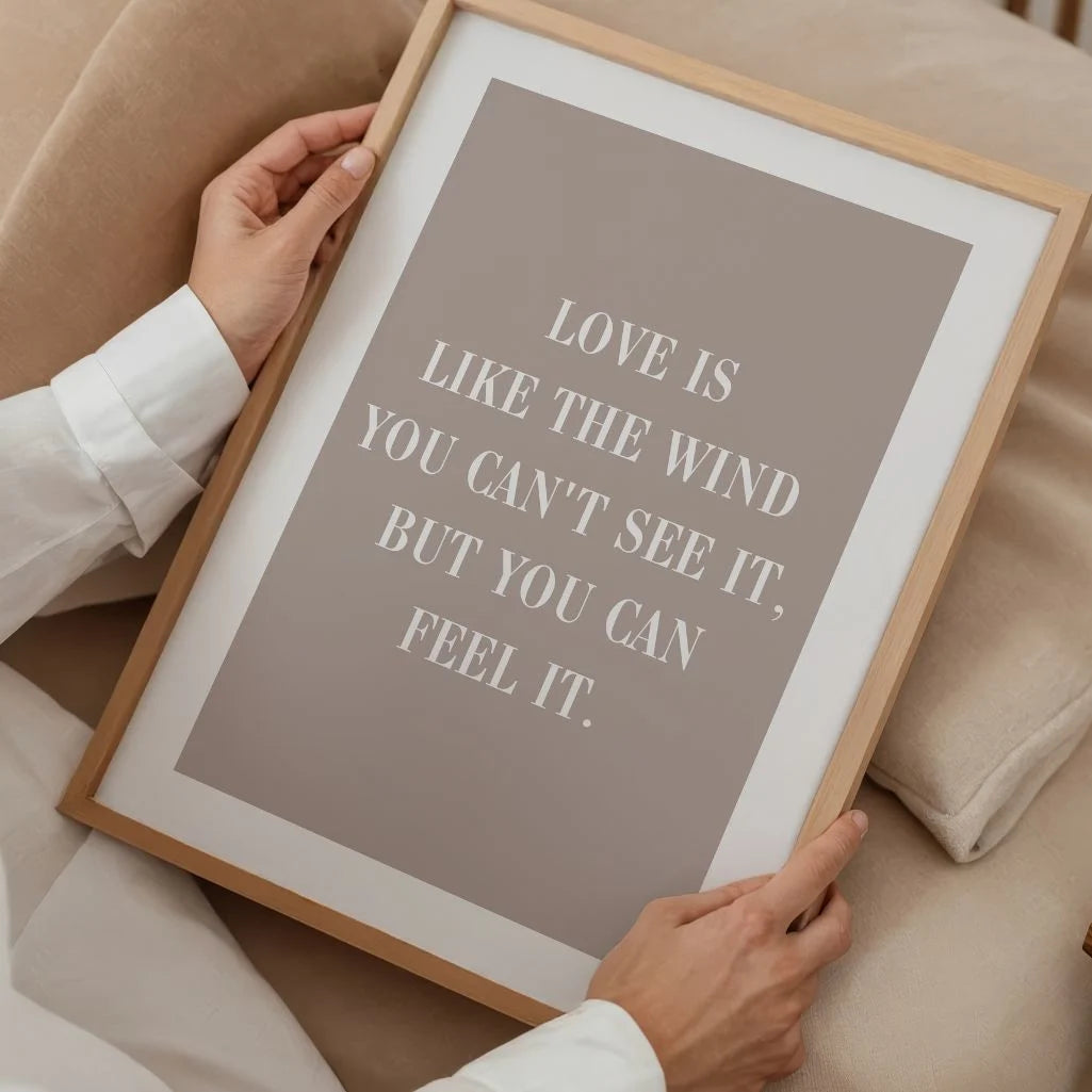 minimalist love quote wall art in a cosy reading corner
