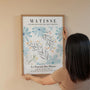 Matisse inspired blue flowers poster displayed in modern gallery wall arrangement
