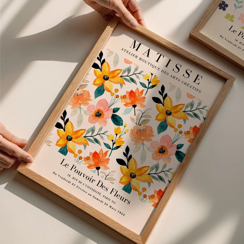 Close up of orange floral watercolor poster showing soft textures and warm tones