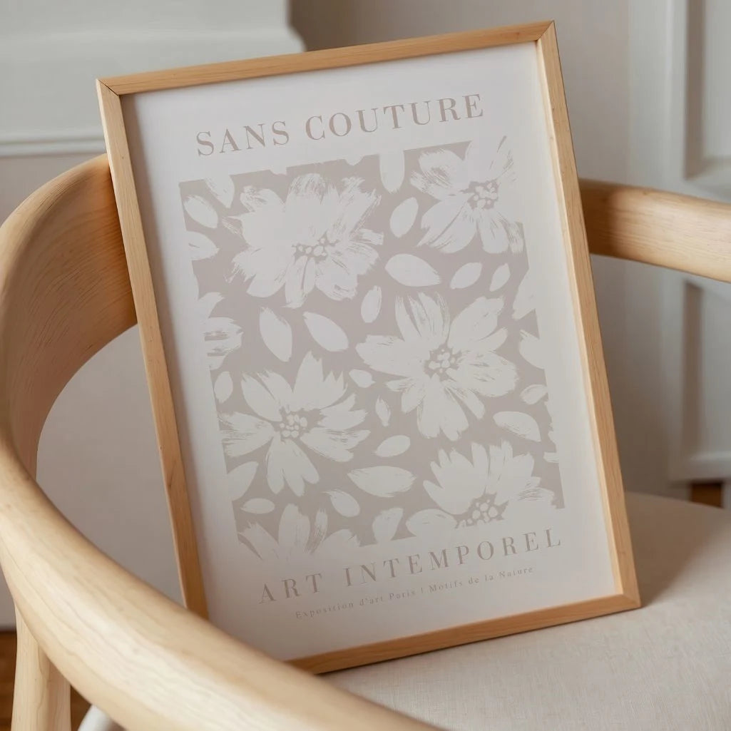 Pastel beige floral poster displayed in gallery wall with light neutral decor
