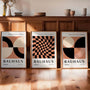 caramel and black bauhaus poster set with cream tones in loft interior