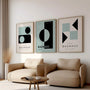 green grey and black geometric bauhaus poster set in contemporary office workspace